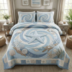 Sea Star Serenade quilted 3-piece bedding set on a made bed with two matching pillow shams
