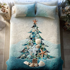 Seashell Wishes quilted 3-piece bedding set on a made bed with two matching pillow shams