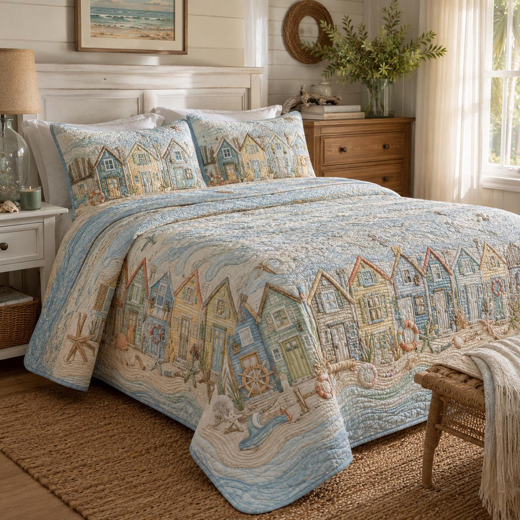 Seaside Village quilted 3-piece bedding set on a made bed with two matching pillow shams