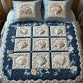 Shell Grid quilted 3-piece bedding set on a made bed with two matching pillow shams