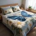 Sky Petals quilted 3-piece bedding set on a made bed with two matching pillow shams