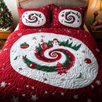 Snowflake Swirl quilted 3-piece bedding set on a made bed with two matching pillow shams