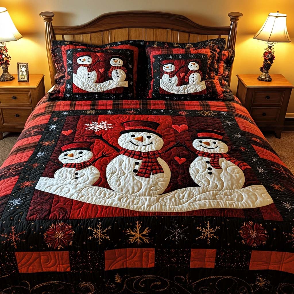 Snowman Family quilted 3-piece bedding set on a made bed with two matching pillow shams