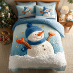 Snowman Joy Christmastree quilted 3-piece bedding set on a made bed with two matching pillow shams