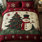 Snowman Joy Xmas quilted 3-piece bedding set on a made bed with two matching pillow shams