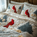 Snowy Cardinal quilted 3-piece bedding set on a made bed with two matching pillow shams