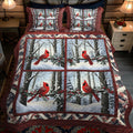Snowy Cardinal Dreams Quilted Bedding Set quilted 3-piece bedding set on a made bed with two matching pillow shams