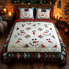 Snowy Cheer Holiday quilted 3-piece bedding set on a made bed with two matching pillow shams