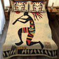 Southwest Reflections quilted 3-piece bedding set on a made bed with two matching pillow shams