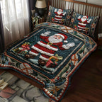 Sparkling Snowy Santa quilted 3-piece bedding set on a made bed with two matching pillow shams