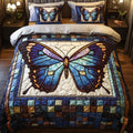 Stained Glass Butterfly quilted 3-piece bedding set on a made bed with two matching pillow shams