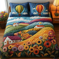 Sunflower Meadow Floral quilted 3-piece bedding set on a made bed with two matching pillow shams