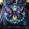Sunlit Butterfly quilted 3-piece bedding set on a made bed with two matching pillow shams