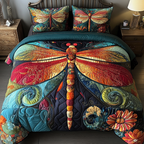 Sunset Flutter quilted 3-piece bedding set on a made bed with two matching pillow shams