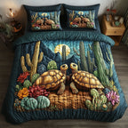 Sunset Shell Cacti quilted 3-piece bedding set on a made bed with two matching pillow shams
