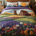Timeless Windmills quilted 3-piece bedding set on a made bed with two matching pillow shams