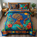 Tropical Afro Bloom quilted 3-piece bedding set on a made bed with two matching pillow shams