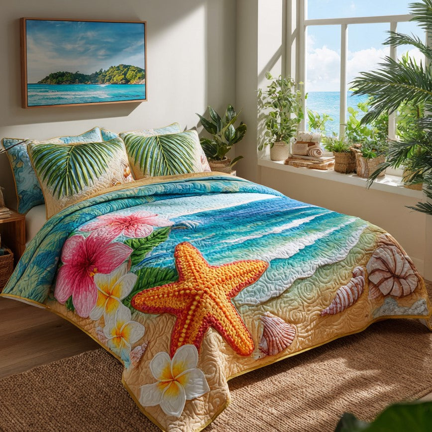 Tropical Starfish quilted 3-piece bedding set on a made bed with two matching pillow shams