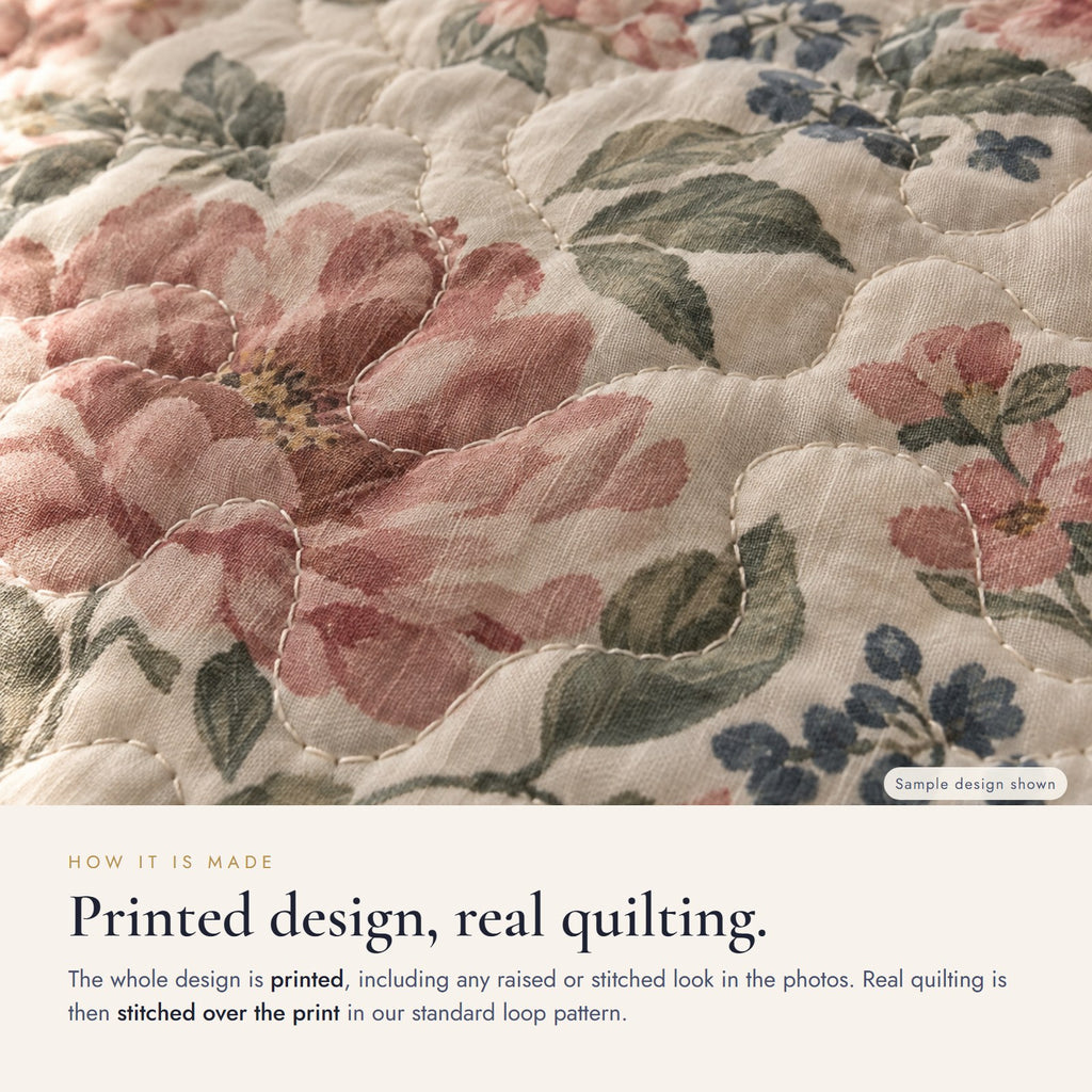 Close-up: the design is printed, and real quilting is stitched over the print in a standard loop pattern (sample design shown)