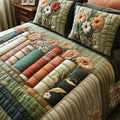 Vintage Book Haven quilted 3-piece bedding set on a made bed with two matching pillow shams