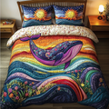 Whale Horizon quilted 3-piece bedding set on a made bed with two matching pillow shams
