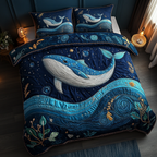 Wild Whale quilted 3-piece bedding set on a made bed with two matching pillow shams