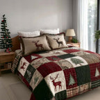Winter Pine Dreams quilted 3-piece bedding set on a made bed with two matching pillow shams