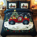 Winter Truck Rally quilted 3-piece bedding set on a made bed with two matching pillow shams