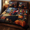 Witch Wisdom quilted 3-piece bedding set on a made bed with two matching pillow shams